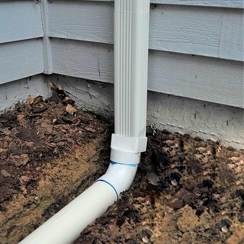 The Drying Co./ThermalTec installs gutter downspout extensions in Yorktown
