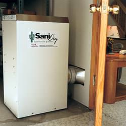A basement dehumidifier with an ENERGY STAR® rating ducting dry air into a finished area of the basement  in Colonial Heights