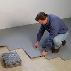 basement subfloor tiles being installed by a contractor in Hanover