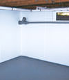Henrico, VA wet basement wall covering that tucks into a perimeter drainage system